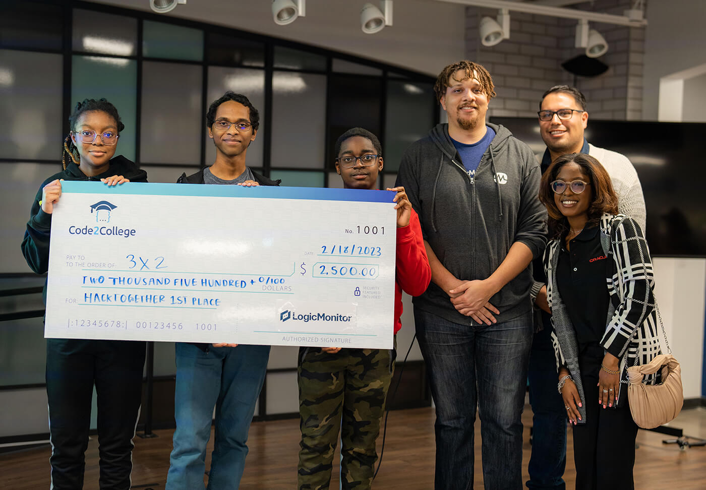 Code2College students winning Hacktogether's 1st place prize